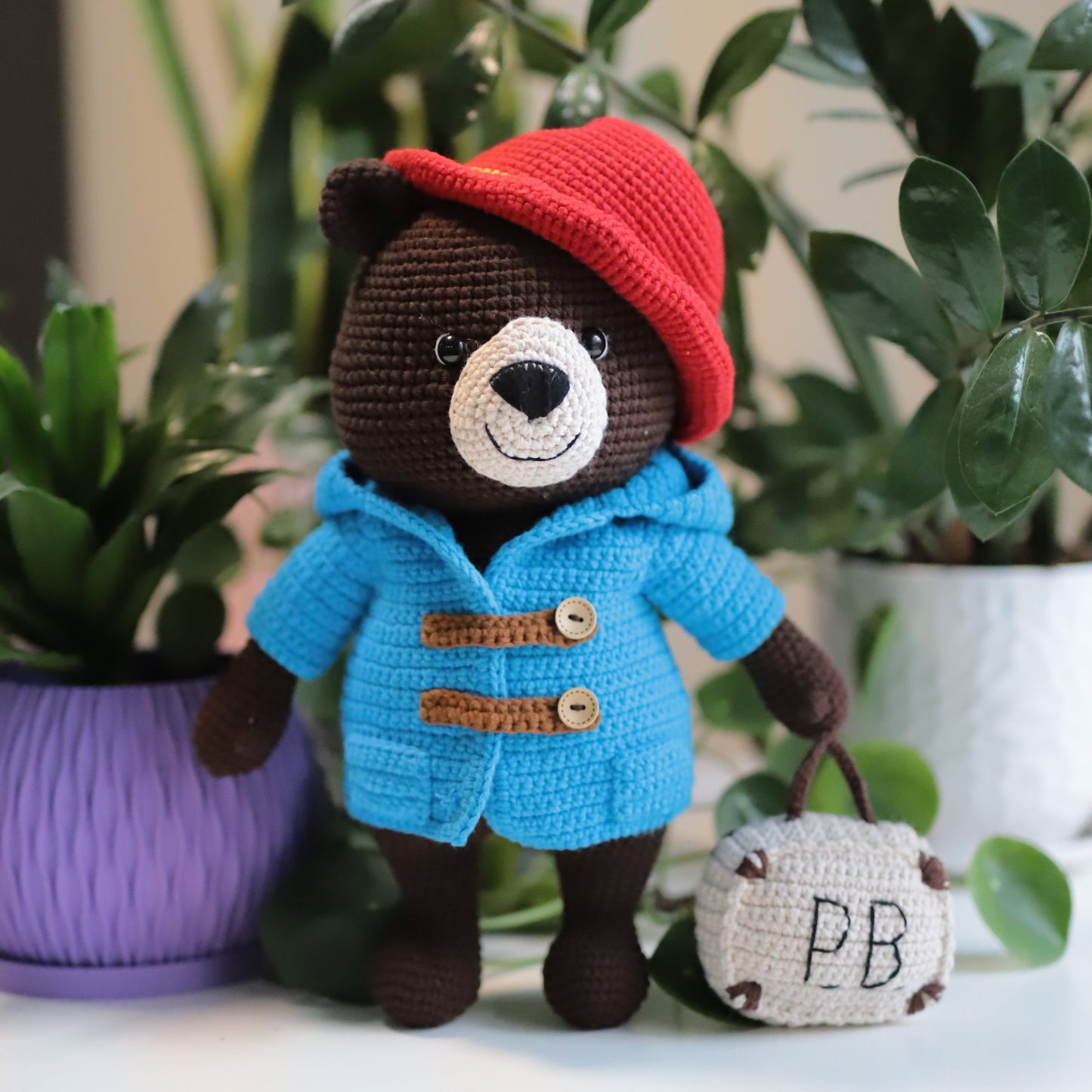 Chubby brown bear with a red hat